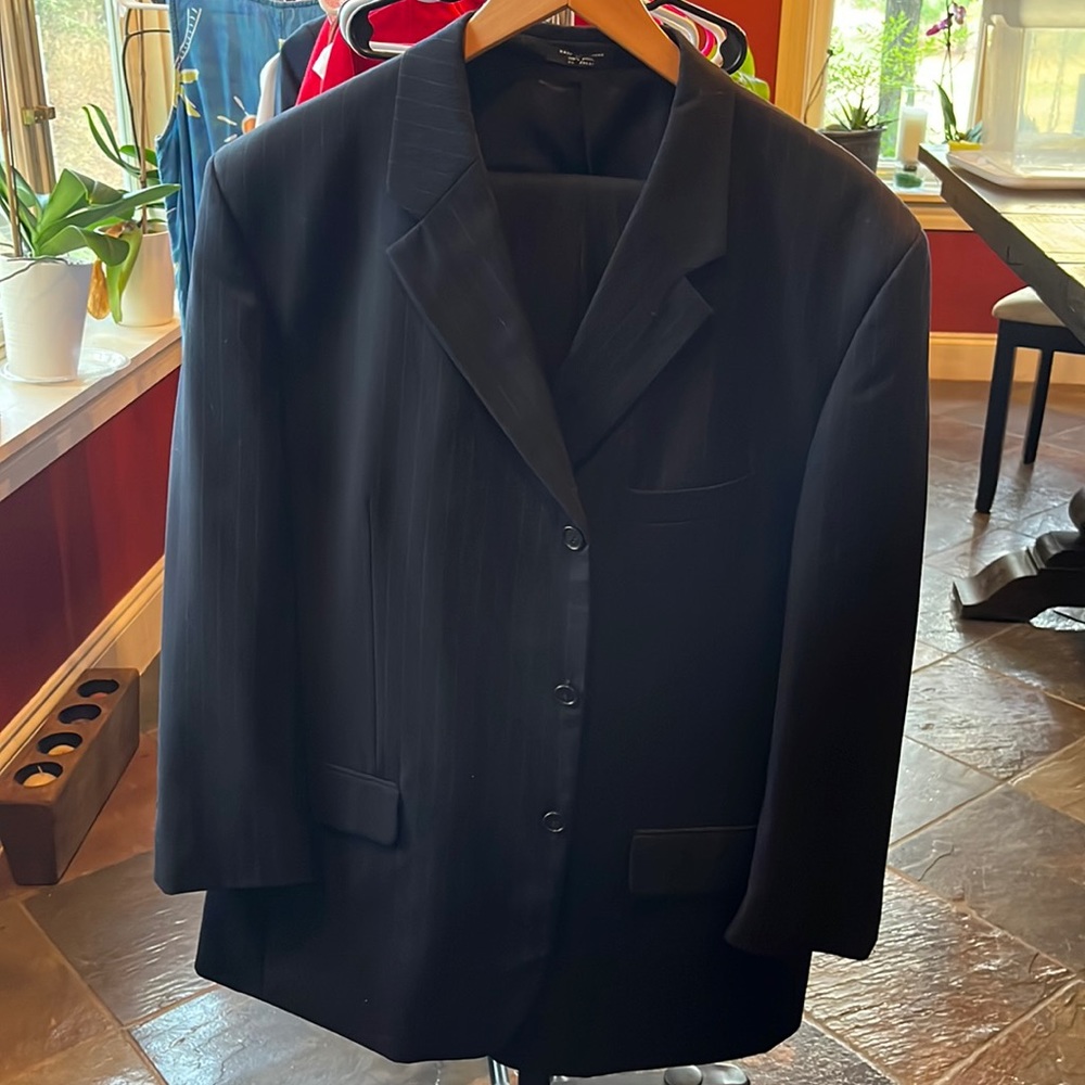 Black striped Paulo Solari men’s three button two piece suit. 100% wool. Size 38